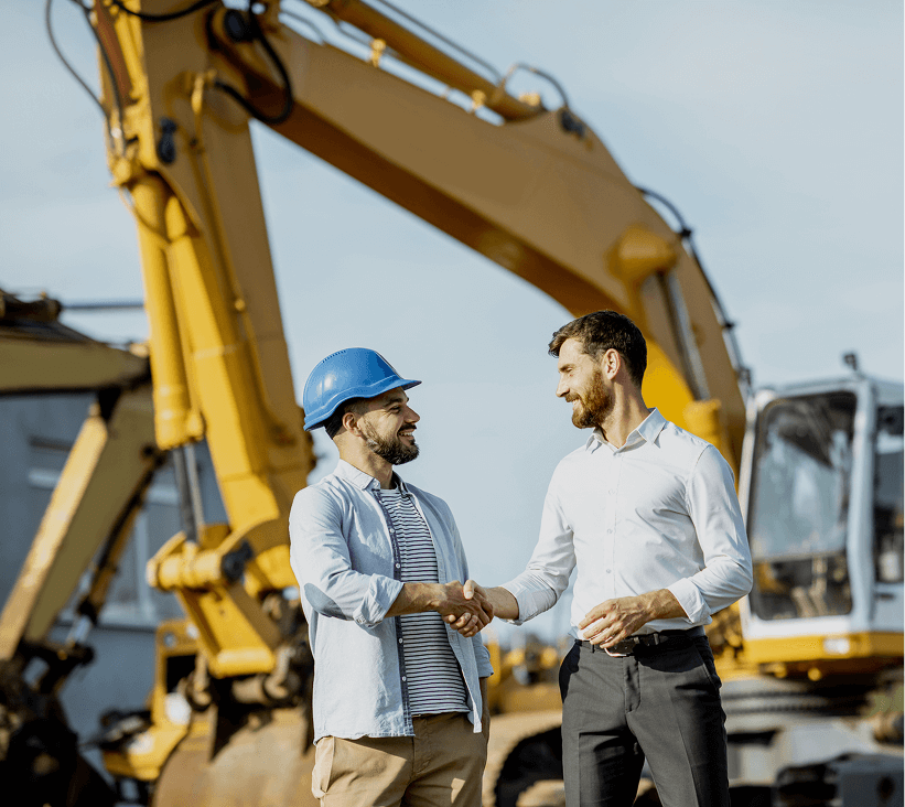 Men in hard hats handshake